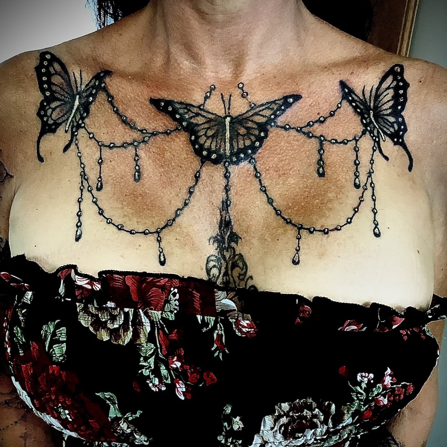 Chest piece with three butterflies and hanging jewel chains